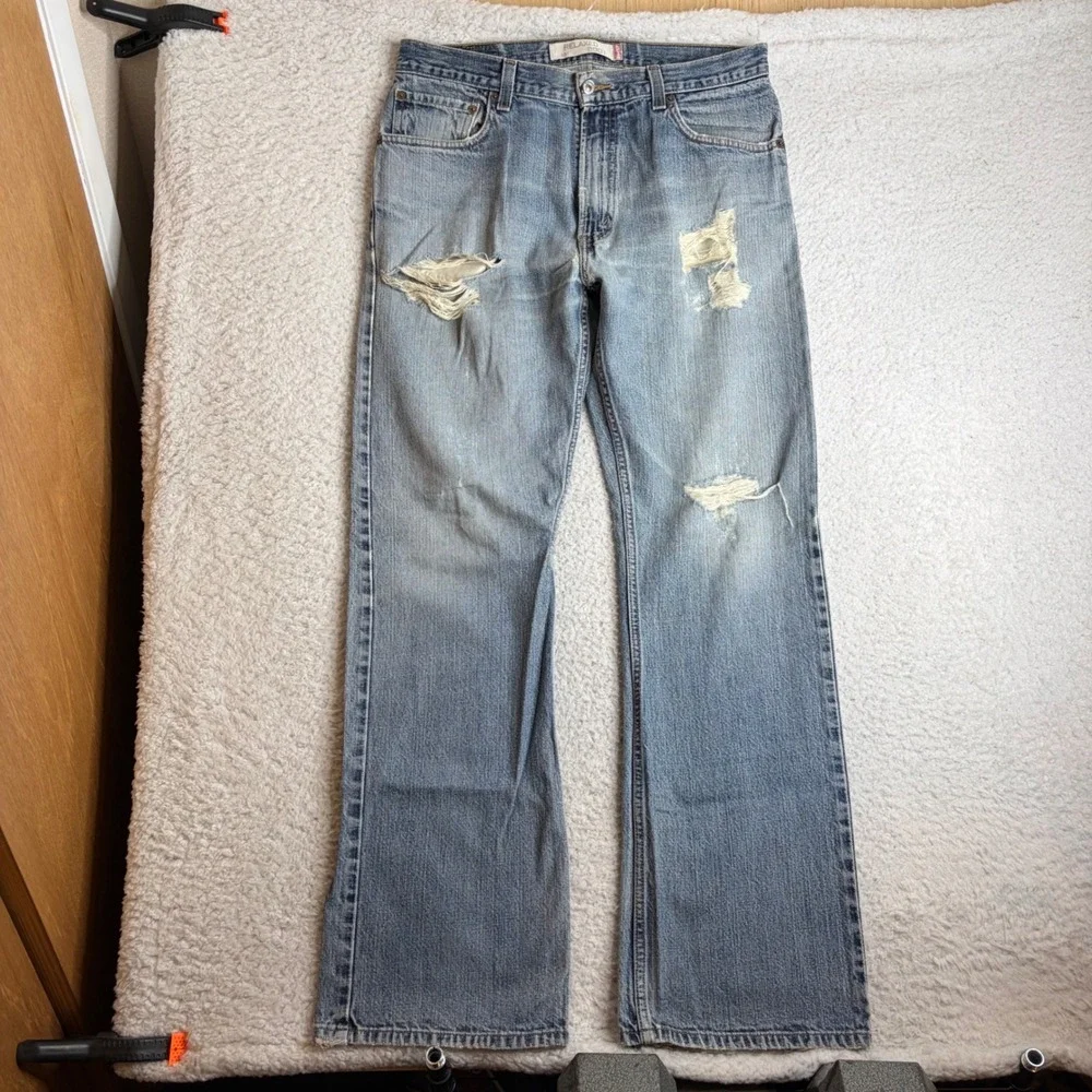 Y2K Levis 557 Relaxed Bootcut Jeans Mens 34x34 Light Wash Distress Denim FADE